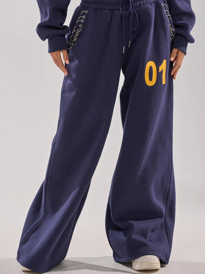 UNTAMED METAL RING SWEATSHIRT AND JOGGER