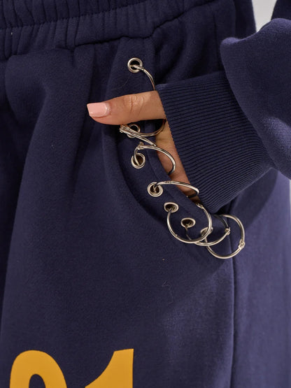 UNTAMED METAL RING SWEATSHIRT AND JOGGER